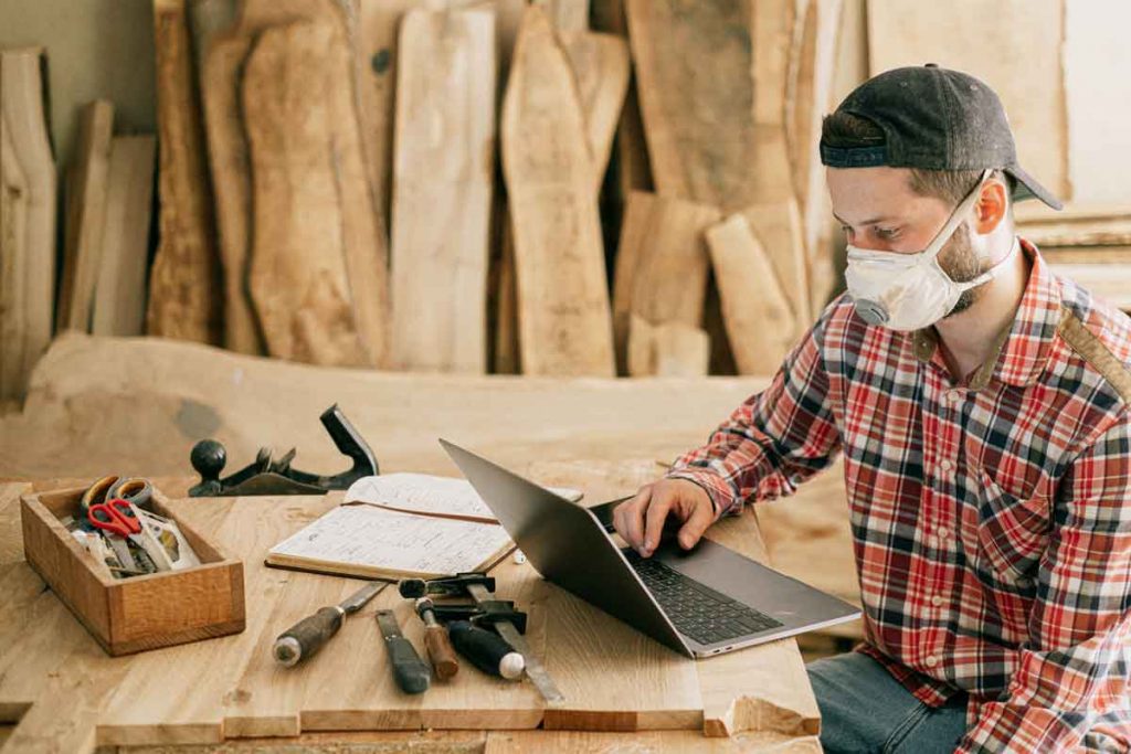 construction insurance cyber risk - man in front of computer