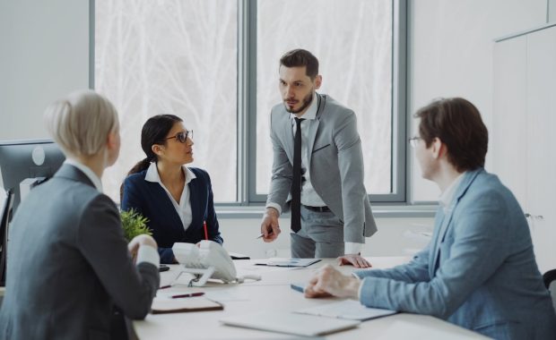 Company directors and executives in a boardroom meeting in Australia