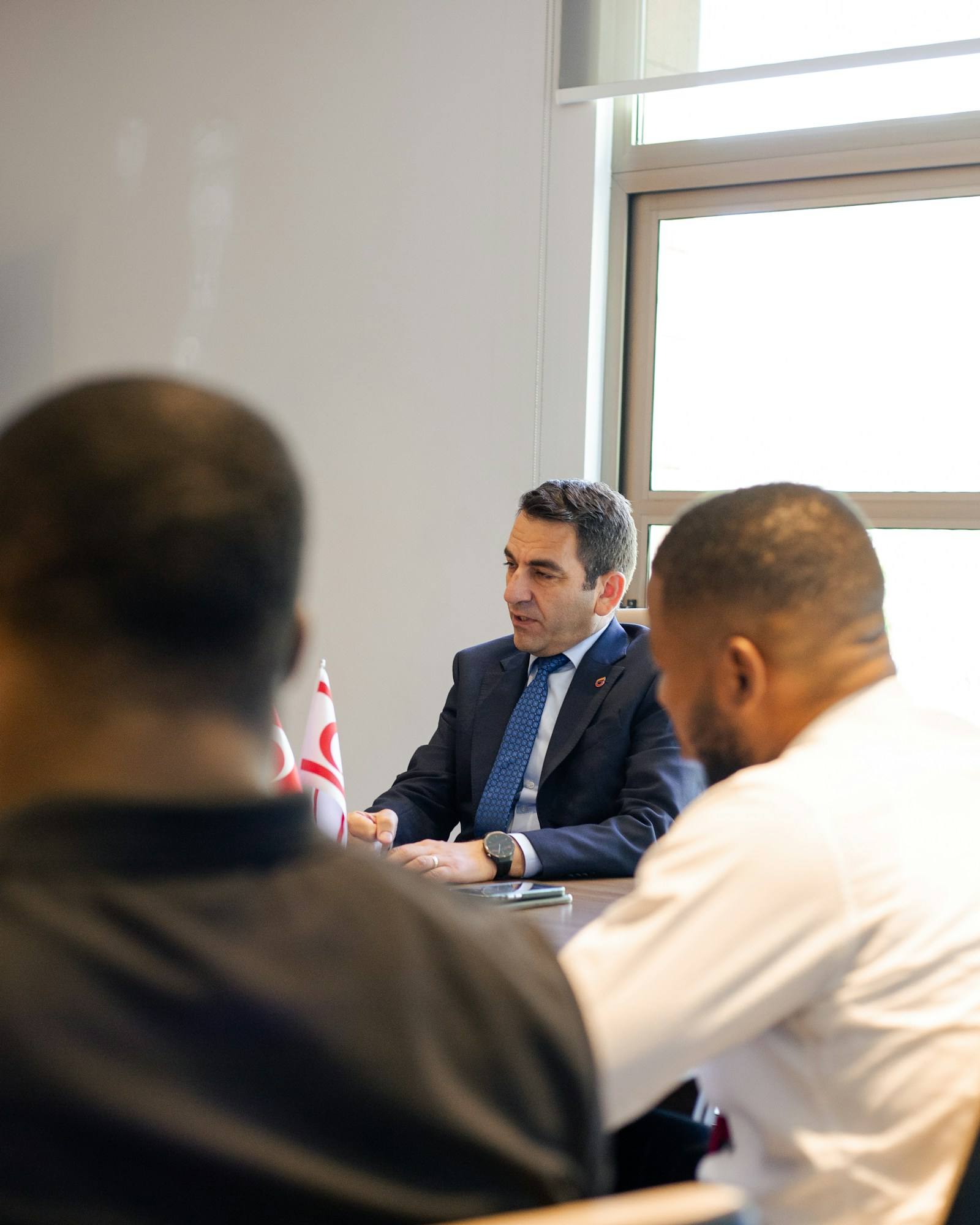 Business executives meeting with an insurance broker to review directors and officers cover